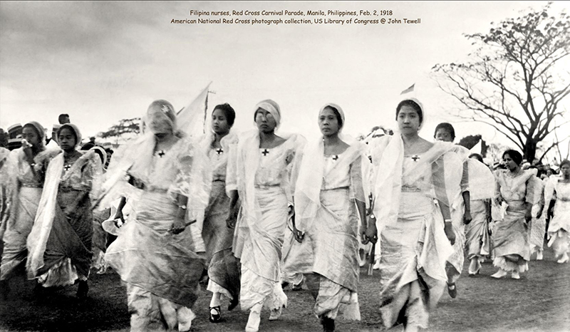 A historical photo of Pilipino nurses marching in a Red Cross Parade.