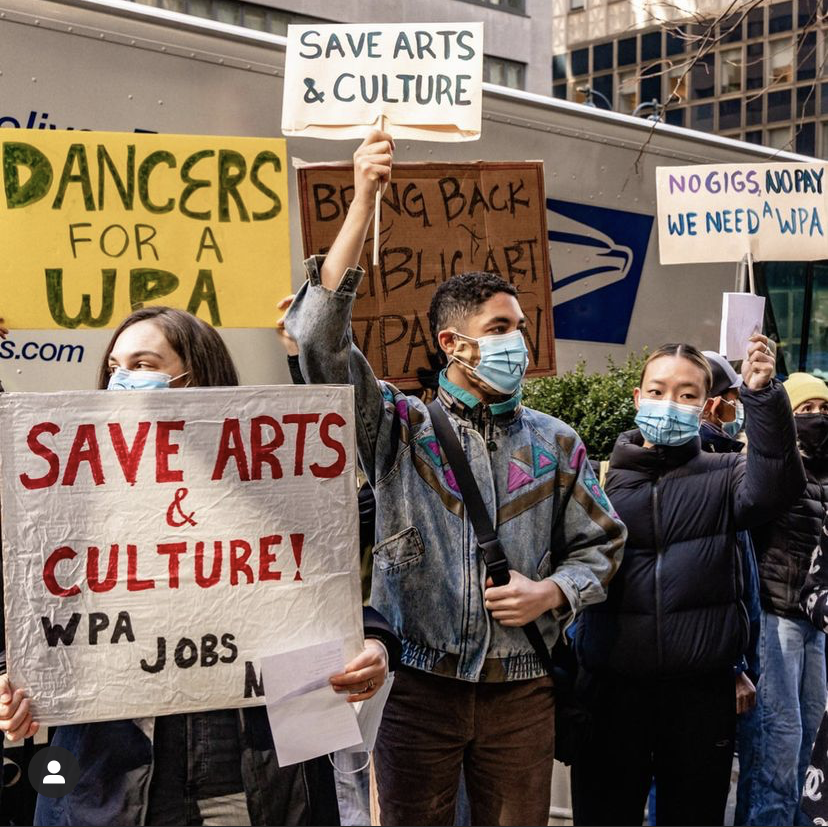 Protestors carrying signs that say "Save Arts and Culture" and "Dancers for a WPA"