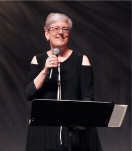 Debra Cash at podium