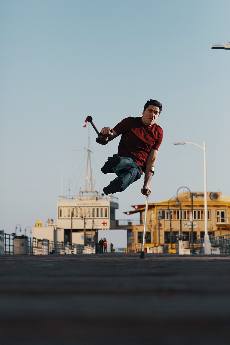 Luca Patuelli breakdancing near a pier