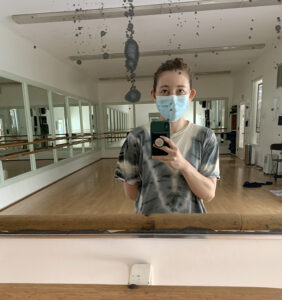Erin selfie looking in studio mirror