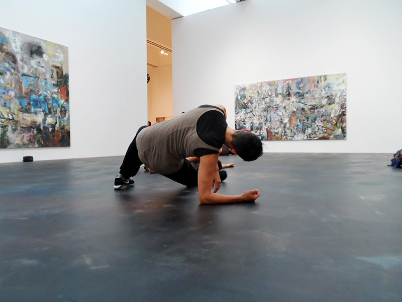 Hope Mohr dancing on the floor of an art gallery