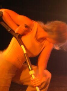 Nadia leaning and pushing on crutch close up